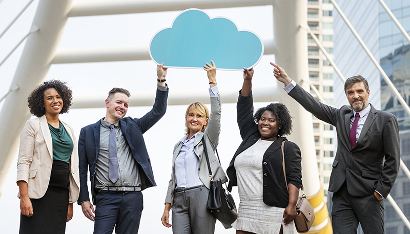 Successful business people in the city keeping a blue cloud